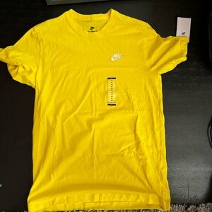Yellow Nike short sleeve tee shirt.